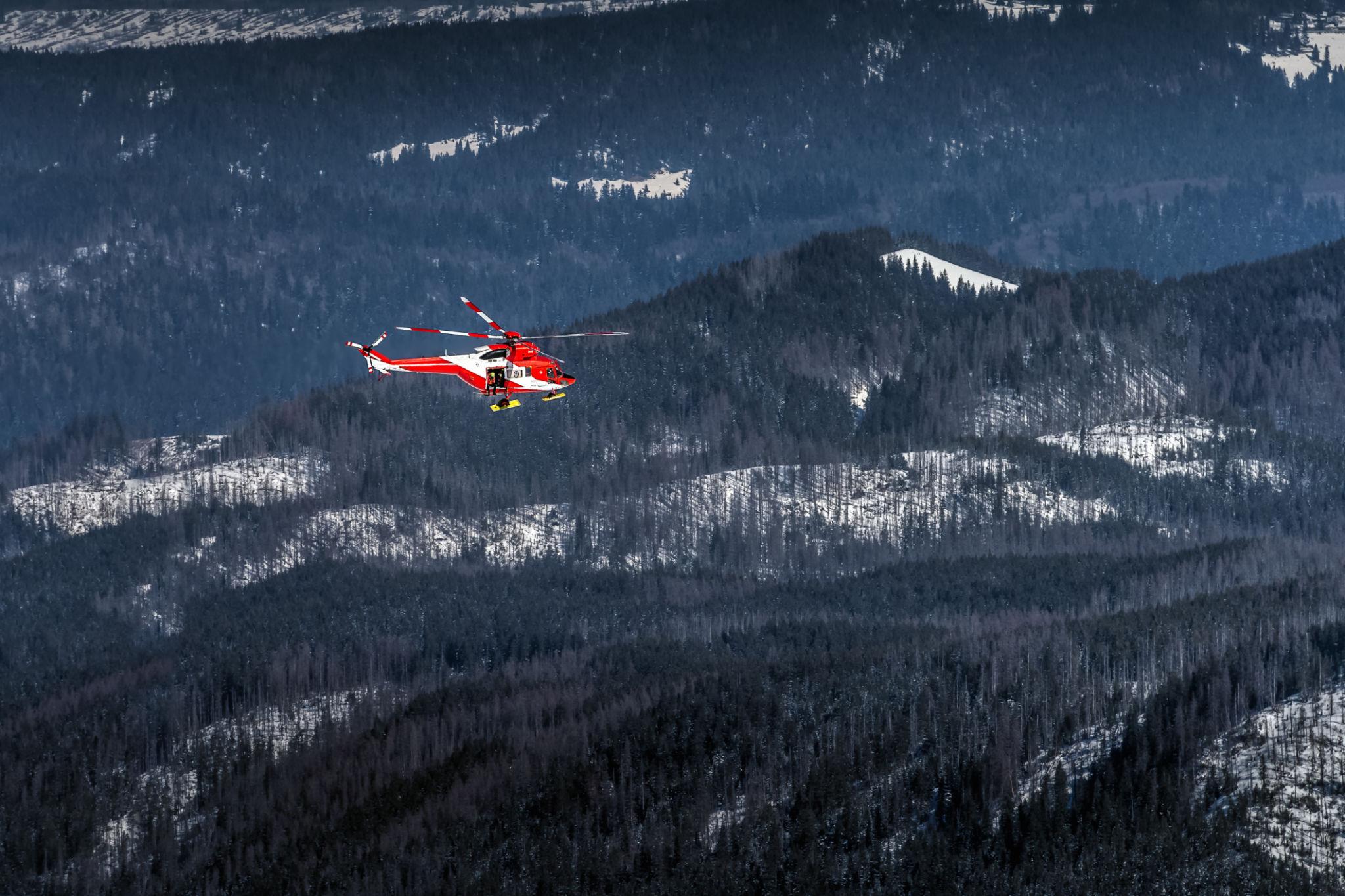 Search and rescue team moving through terrain